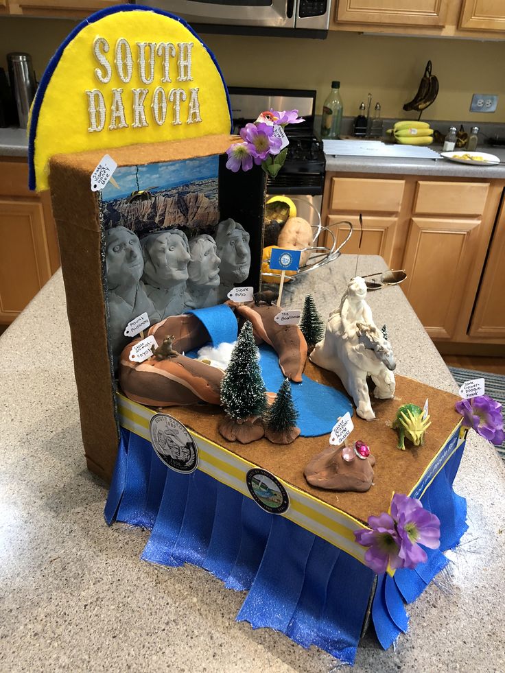 a cardboard box that is sitting on top of a counter with various items in it