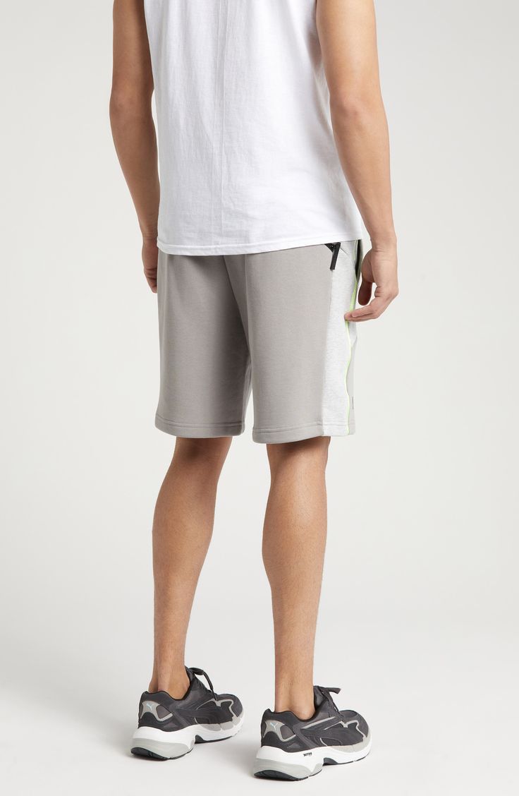 PUMA and LA-based label PLEASURES collaborate on these comfy cotton French terry sweat shorts done in a cool colorblock style with neon trim. 8" inseam; 25" leg opening; 13" front rise; 16 1/2" back rise (size Medium) Elastic/drawstring waist Front welt pockets 70% cotton, 30% recycled cotton Machine wash, tumble dry Imported PUMA has received the Fair Labor Association accreditation, which signifies that the company has effective systems and procedures in place to successfully uphold fair labor standards throughout its supply chains, including strategies and tools to address and improve working conditions Sporty Cotton Shorts For Leisure, Athleisure Cotton Shorts For Leisure, Cotton Athleisure Shorts For Leisure, Sporty Cotton Athletic Shorts For Leisure, Cotton Athleisure Athletic Shorts For Loungewear, Cotton Sportswear Shorts For Leisure, Cotton Athletic Shorts With Side Pockets For Loungewear, Relaxed Fit Cotton Sportswear Shorts, White Casual Athletic Shorts With Side Pockets