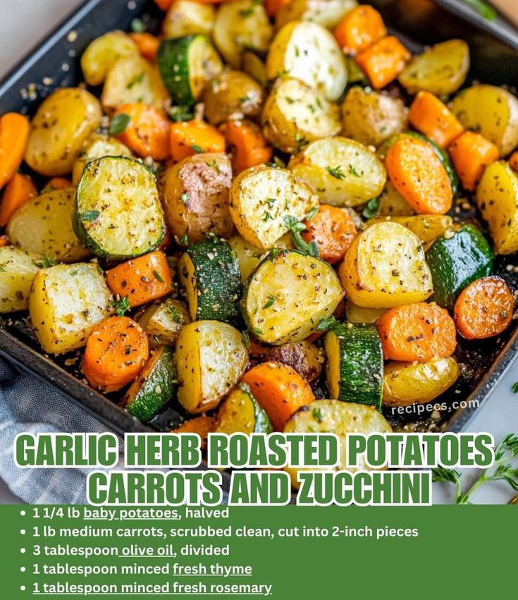 garlic herb roasted potatoes, carrots and zucchini in a baking pan with text overlay