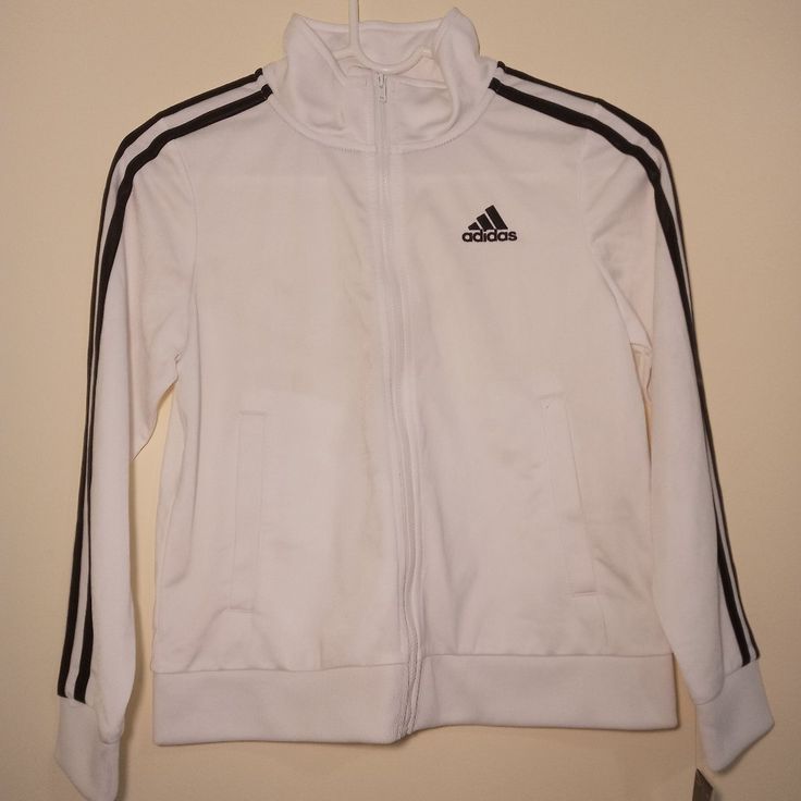 Adidas Boys' Extended Sizing Zip-Front Iconic Tricot Jacket White, Small 8-Plus, New Adidas Long Sleeve Outerwear With Three Stripes, White Sports Outerwear With Three Stripes Branding, White Track Jacket With Three Stripes, Casual White Track Jacket With Three Stripes Branding, Hooded Outerwear With Three Stripes For Fall, Cotton Outerwear With Three Stripes For Fall, Adidas Cotton Track Jacket For Fall, Adidas Three Stripes Fall Outerwear, Adidas Outerwear With Three Stripes For Fall