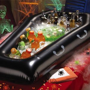 an inflatable hot tub filled with bottles and drinks on top of a table