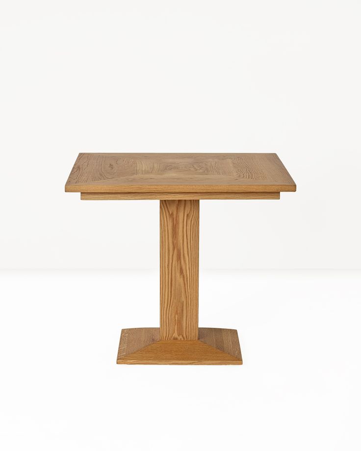 a square wooden table on a white background