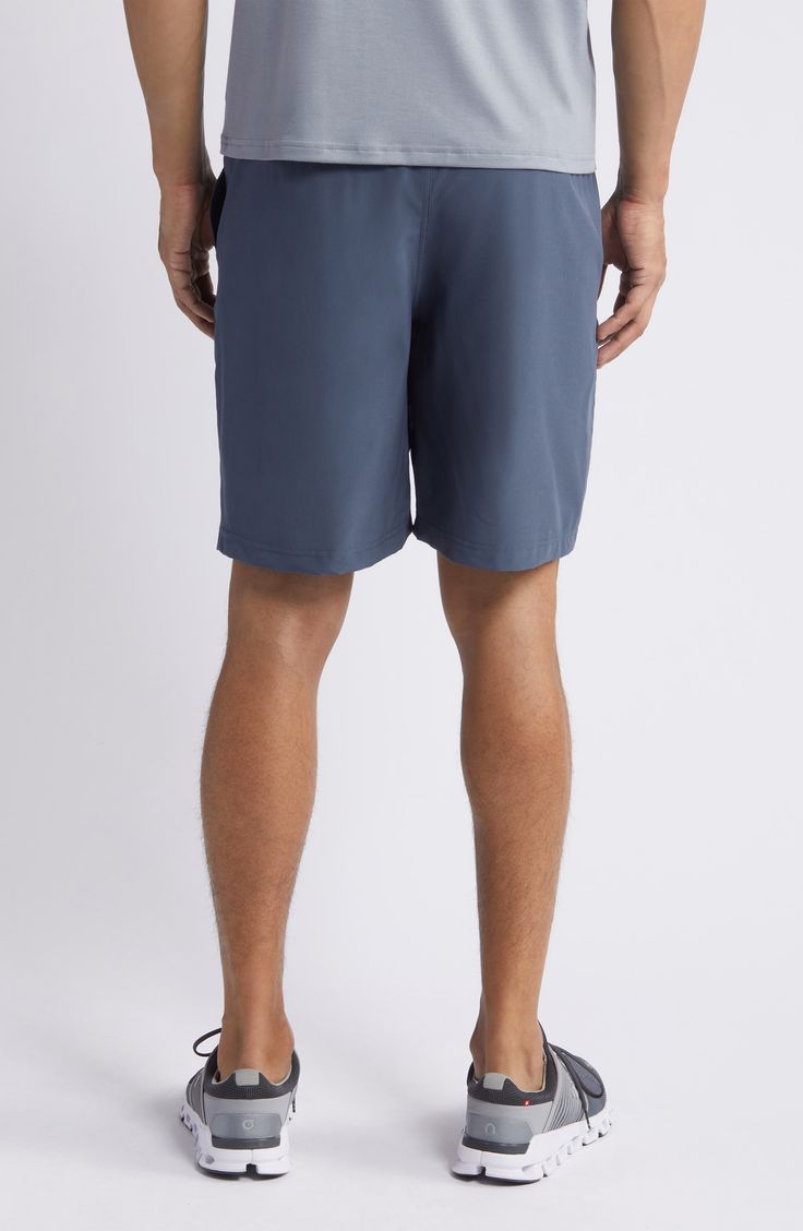 Move with ease throughout your day in these sporty shorts cut from stretch fabric with UPF sun protection 8" inseam Elastic/drawstring waist Front slant pockets; back patch pocket UPF 50+ sun protection 86% polyester, 14% spandex Machine wash, line dry Imported Sporty Swim Trunks With Built-in Shorts, Sportswear Swim Trunks With Built-in Shorts, Comfort Waistband Nylon Shorts, Short Swim Trunks With Side Pockets, Moisture-wicking Beachwear Shorts, 4-way Stretch Beachwear Shorts For Sports, Nylon Athletic Shorts With Drawstring, Blue Gym Bottoms With Functional Drawstring, Relaxed Fit Athletic Shorts With Built-in Shorts For Beachwear