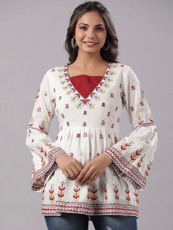 * Red & White Embroidered Cotton Dobby Tunic Printed Kurti / Embroidered Short Kurti / Indian Tunic / Summer-Spring Evening Dress / Cotton Tunic Tops Boho Tunic / Hippie Dress / Tribal Print Top * Red and White embroidered a-line kurti * Embroidered detailing  * Round neck, three-quarter, bell sleeves * Pure cotton *Fabric:-  Cotton Donny *Wash Care:-  Hand-wash AVAILABLE IN 6 SIZES THEY ARE IN FOLLOWING MEASUREMENTS IN INCHES:- XS:- Bust-34/Waist-28/Length-29 S:- Bust-36/Waist-30/Length-29 M:- Bust-38/Waist-32/Length-29 L:- Bust-40/Waist-34/Length-29 XL:- Bust-42/Waist-36/Length-29 XXL:- Bust-44/Waist-38/Length-29 NOTE ►►CUSTOMISATION We do customisation ️ ►►TRACKING We give full tracking to our valuable customers, you can track your package any time with tracking code provided by our sho White Embroidered V-neck Kurta, Red Chikankari Embroidery Sets For Spring, Spring Red Chikankari Embroidered Sets, Traditional V-neck Blouse With Printed Motifs, White V-neck Festive Kurta, Festive Anarkali Tops For Spring, Festive Floral Embroidered Tunic For Navratri, Spring Anarkali Long Sleeve Blouse, Cotton Floral Embroidered V-neck Sets