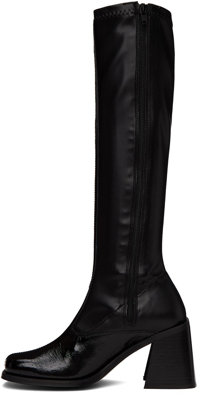 Handcrafted knee-high paneled grained patent leather and stretch faux-leather boots in black. · Square toe · Zip closure at inner sides · Padded leather footbed · Stacked leather block heel with rubber injection · Buffed leather sole · Heel: H3.25 in Supplier color: Black Knee-high Polyurethane Boots Medium Width, Formal Knee-high Polyurethane Boots, Fitted Knee-high Faux Leather Boots, Fitted Leather Mid-calf Heeled Boots, Black Tall Knee-high Boots With Reinforced Heel, Black Knee-high Boots With Reinforced Heel, Faux Leather Fitted Boots For Work, Fitted Faux Leather Boots For Work, Knee-high Heeled Boots In Polyurethane