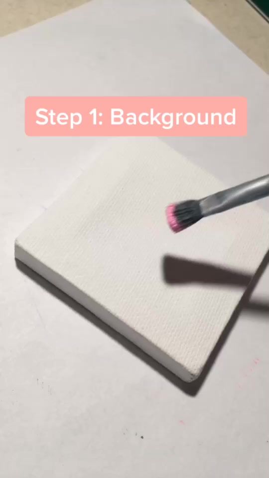 a white notebook with a brush on top of it and the words, step 1 background