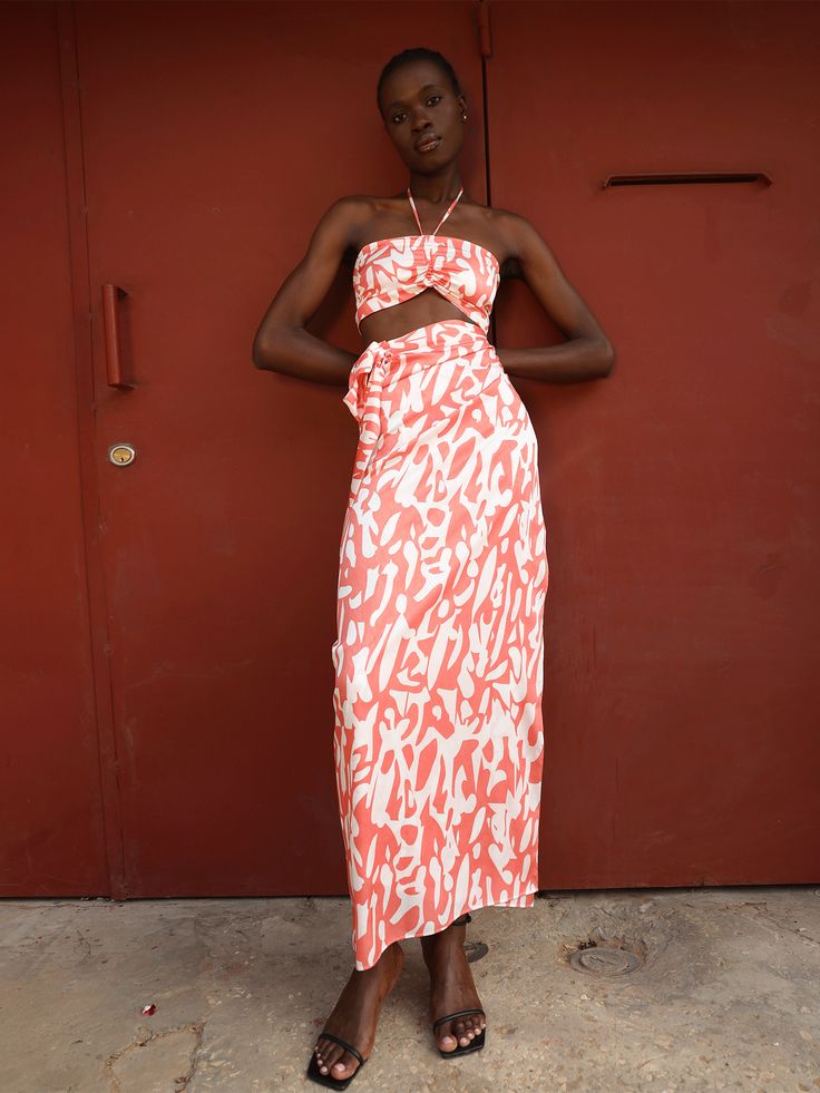 Our Seur skirt is your Summer must-have piece. Inspired by West African traditional wrap skirts, it delicately drapes around your waist and hips to create a wrap look that flatters your figure. Style it with our Ina Top for a look that is vacation or party-ready. You can also tie it in multiple ways for an expansive wardrobe. Wrap Convertible Skirt Tie fastening at the waist Handcrafted in our small atelier in Dakar, Senegal Height customization available 100% polyester jacquard SIZING Sizes XS/ Fitted Wrap Skirt For Summer Brunch, Chic Fitted Wrap Skirt For Brunch, Summer Ruched Asymmetrical Maxi Skirt, Chic Fitted Wrap Skirt For Summer, Chic Ruched Maxi Skirt For Summer, Fitted Asymmetrical Wrap Skirt For Brunch, Feminine Fitted Wrap Skirt For Summer, Summer Dress With Ruched Relaxed Skirt, Chic Wrap Maxi Skirt With Flowy Fit