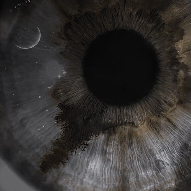 the iris of an eye with two planets in the background