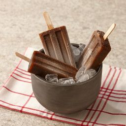 chocolate pops are in a bowl with ice