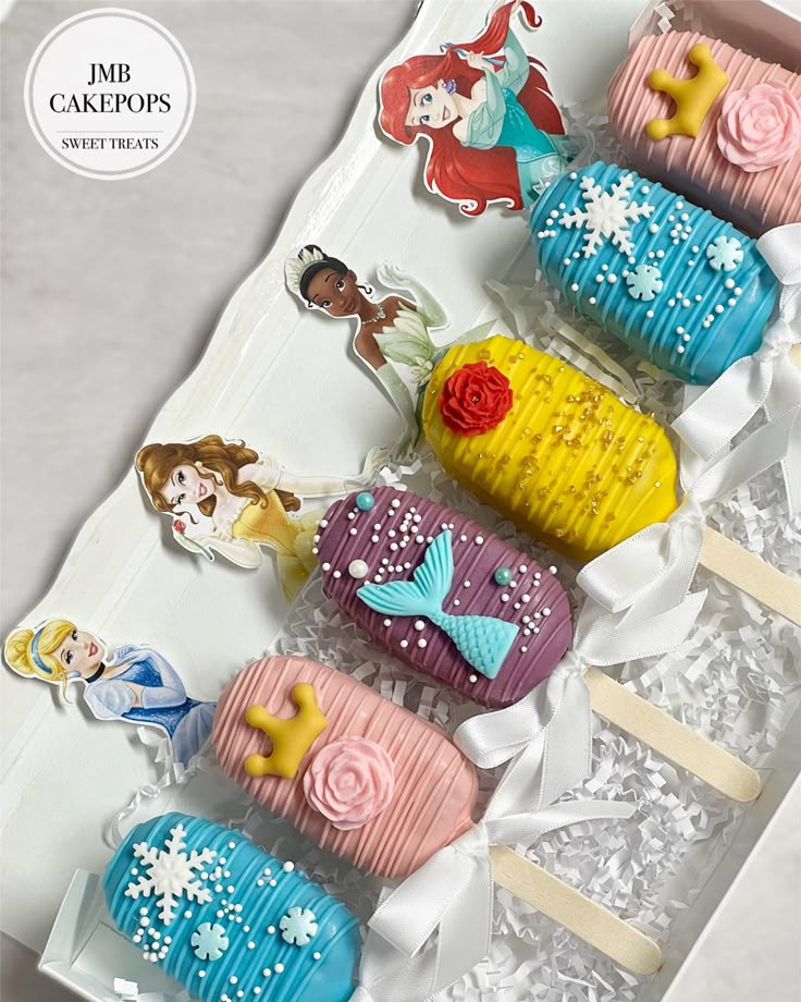 there are some cupcakes that have been made to look like little mermaids