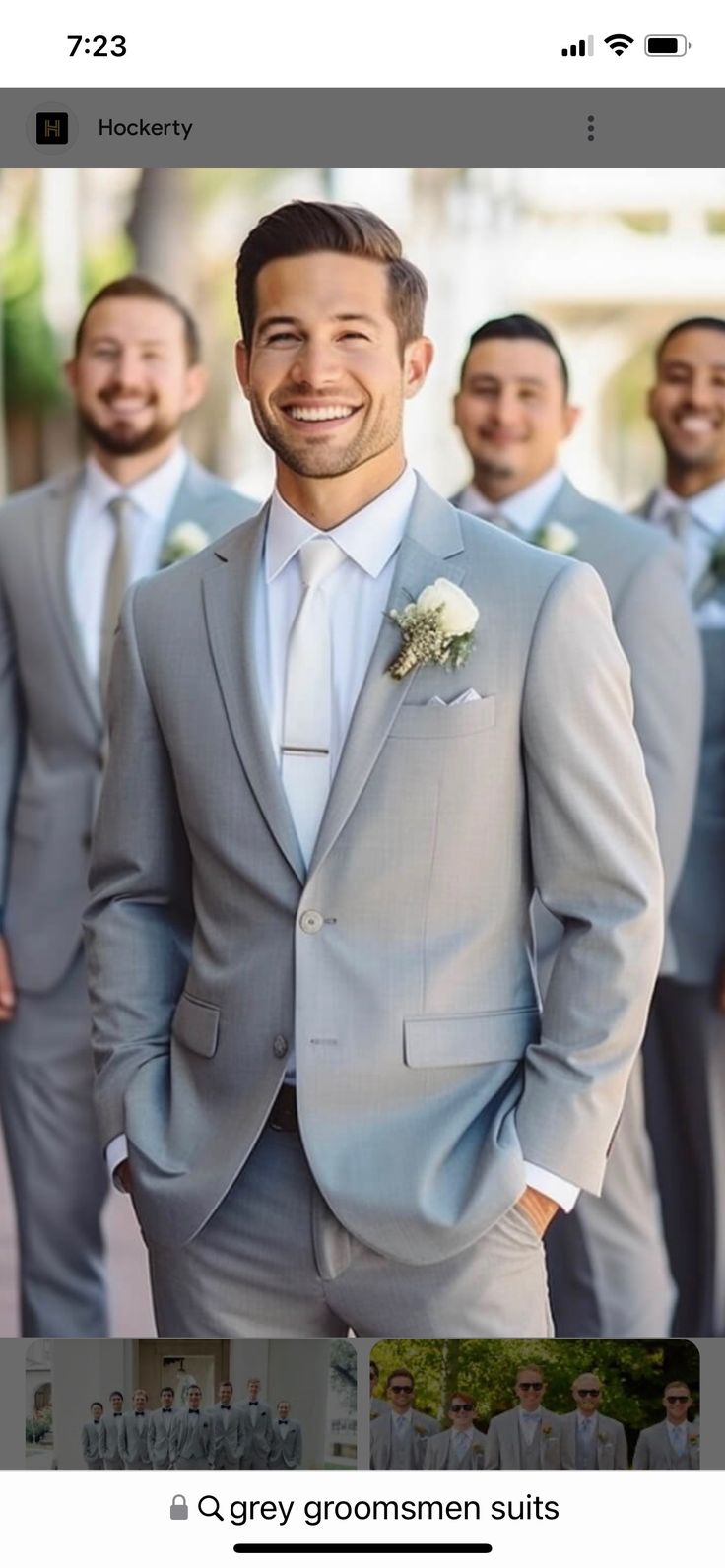 a group of men in suits standing next to each other on a cell phone with the caption grey groomsmen suits