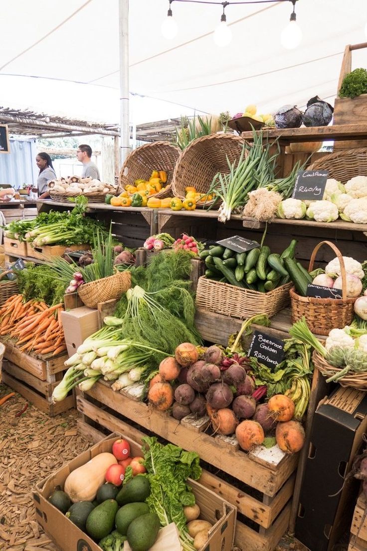 an open air market with lots of fresh fruits and vegetables