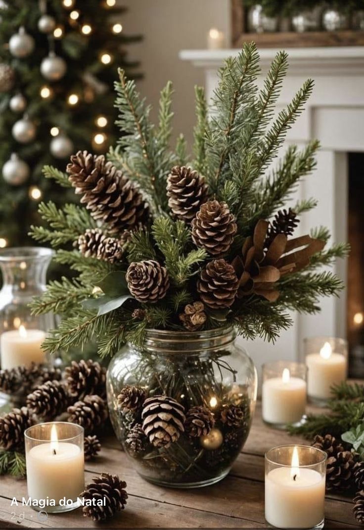 candles and pine cones in a glass jar on a table