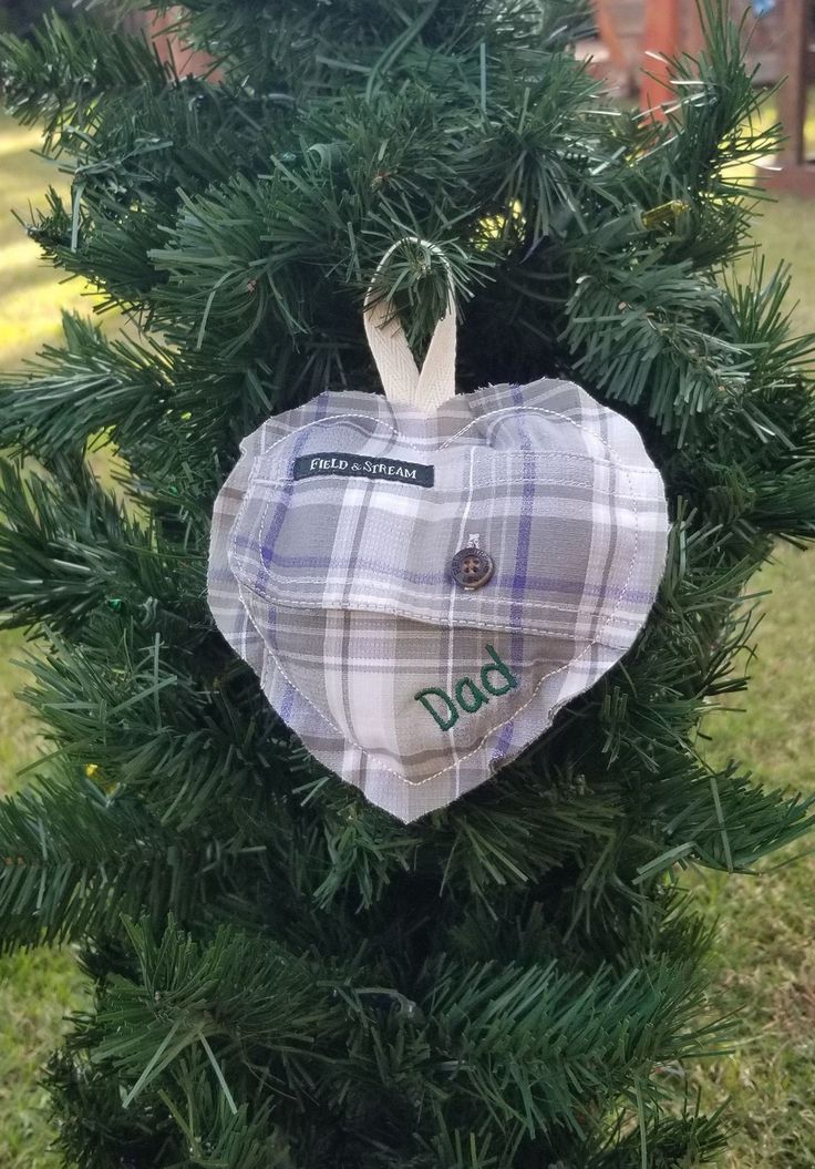 a heart shaped ornament hanging from a tree