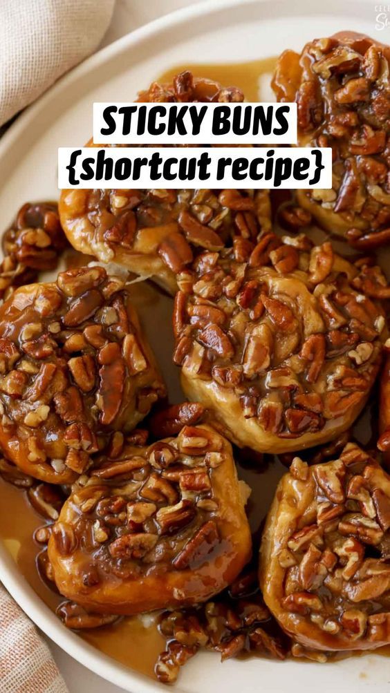 sticky buns with pecans and caramel sauce on top in a white bowl