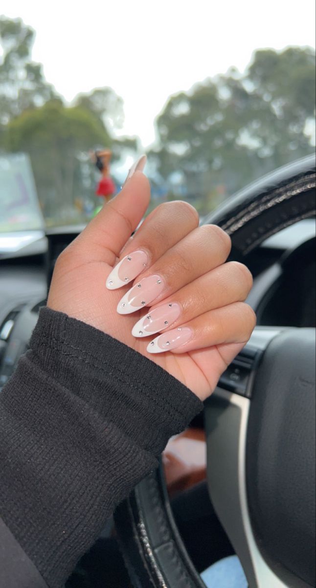 Almond Nails French Tip With Diamond, French Nail Designs Rhinestones, Almond French With Rhinestones, Almond Nails French Tip With Gems, Acrylic French Design, French Mani With Gems, White Almond French Tip Nails With Gems, Mails With Diamond, French Tip Nails With Jewels Rhinestones