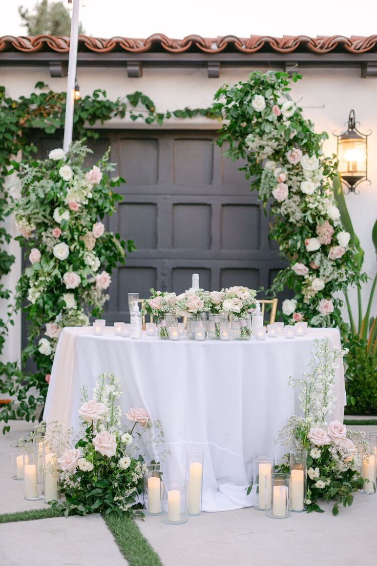 a table with candles and flowers on it