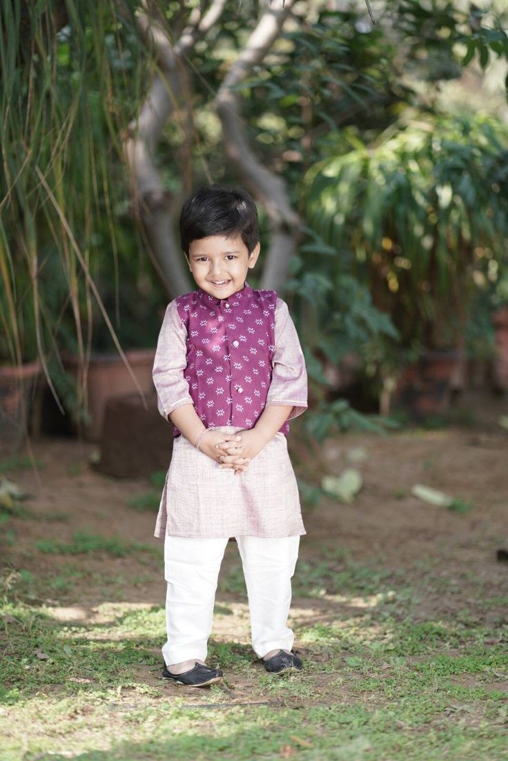 Boys coatee set for summer festivities. Set of 3 - kurta, payjama and jacket. Kurta - Light purple textured kurta with gold embellishments for boys. Fabric cotton silk but is skin-friendly. Jacket - waistcoat styled Nehru collar on deep purple cotton jacket embellished with silver khadi print motifs. Payjama- cotton white payjama Fabric- Cotton Color -  Purple Pattern Floral  Sizes - 6 months to 10 years (please select size at checkout) Approx measurements in inches- Photo attached. Care Guide - Festive Cotton Nehru Jacket Straight Kurta, Cotton Nehru Jacket For Puja And Eid, Cotton Nehru Jacket For Festive Transitional Season, Cotton Nehru Jacket For Eid Puja, Cotton Nehru Jacket For Diwali Festivities, Cotton Nehru Jacket With Dabka For Festive Occasions, Festive Cotton Nehru Jacket With Pallu, Festive Cotton Nehru Jacket With Dabka Details, Eid Nehru Jacket With Multicolor Embroidery