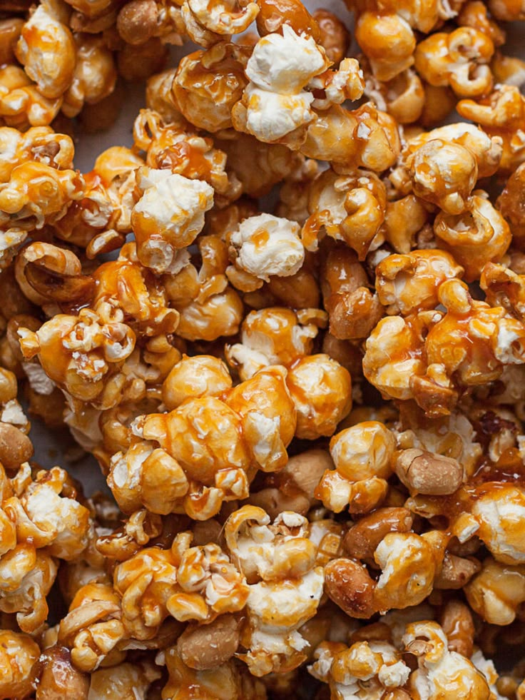 caramel popcorn kernels are piled on top of each other