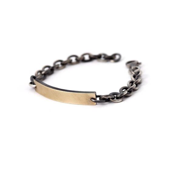 A classic with a twist, this beautiful men’s ID bracelet features a rectangular, slightly arched name plate in 14K yellow gold (.03mm thickover silver 925). The name plate is attached to a thick round linked chain made of solid sterling silver.   I can engrave name or initials you would like Classic Brass Chain Bracelet, Tarnish Resistant, Classic Tarnish Resistant Brass Chain Bracelet, Classic Engraved Link Chain Bracelet, Classic Engraved Oval Link Chain Bracelet, Classic Gold Jubilee Bracelet In Brass, Classic Silver Brass Bracelets, Classic Silver-colored Brass Bracelets, Classic Brass Gold Jubilee Bracelet, Classic Engraved Metal Chain Bracelet