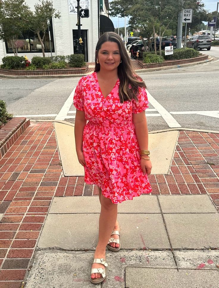 Get ready to blossom in our Pink Floral V Neck Dress! With its fun and flirty ruffle tiered design, this dress will make you stand out from the crowd. Perfect for any occasion, it's a must-have addition to your wardrobe. Embrace your playful side in this unique and stylish dress. Cute Flowy Ruffle Dress For Summer, Casual Tiered Mini Dress For Garden Party, Spring Pink V-neck Tiered Dress, Pink V-neck Tiered Summer Dress, Cute Spring Tiered Dress For Garden Party, Cute Tiered Dress For Spring Garden Party, Spring Ruffle Dress For Day Out, Cute Tiered Dress With Ruffle Hem, Spring Floral Print Ruffle Dress For Day Out