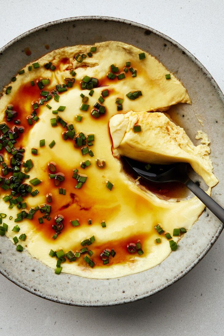 a bowl filled with food on top of a table