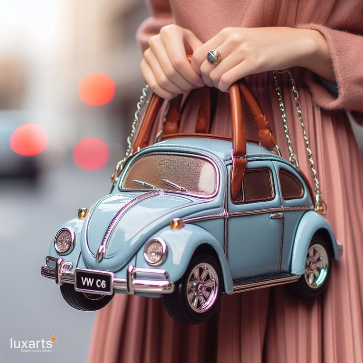 Volkswagen Handbag 🚗👜🌟 #VWHandbag #AutomotiveStyle #RetroFashion Carry your essentials in style with the Volkswagen Handbag. This unique accessory draws inspiration from the iconic VW design, adding a touch of automotive flair to your fashion ensemble. Elevate your look with the Volkswagen Handbag, where every outing becomes a chic journey through the vibrant history of Volkswagen. 🌈👛✨ Funky Purses, Van Ideas, Inspired Handbags, Unique Handbags, Vw Van, Hit The Road, Unique Bags, Futuristic Architecture, Elevate Your Look