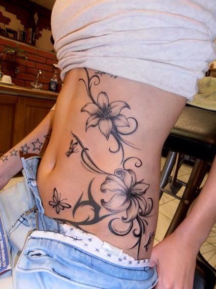 a woman with a tattoo on her stomach