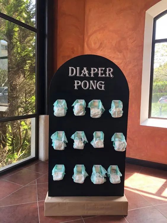 a display case with diaper pong on it in front of a large window