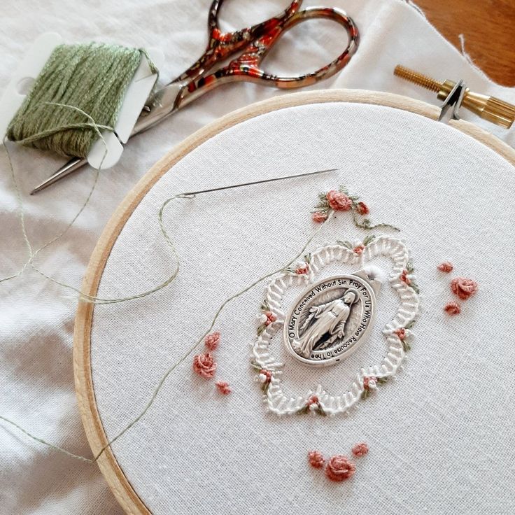 the embroidery is being worked on with scissors