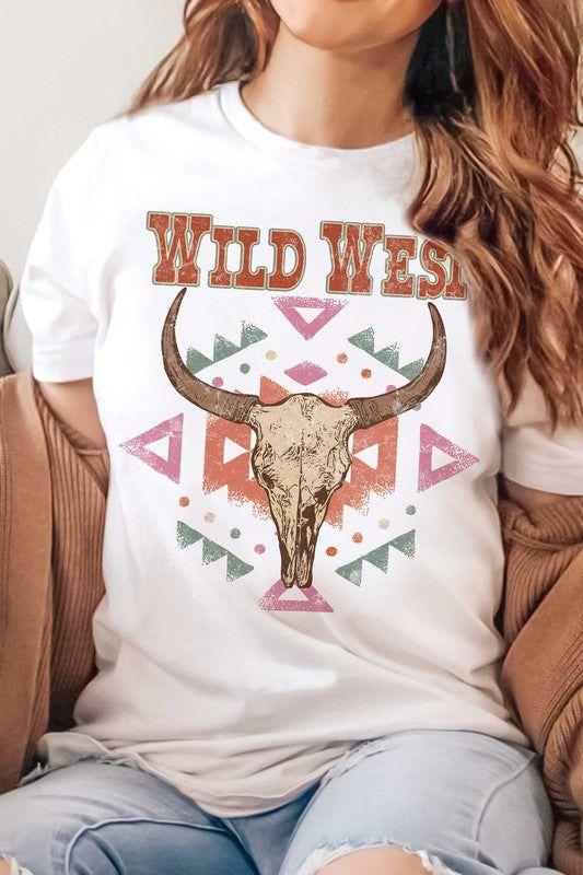 Elevate your western style with our WILD WEST AZTEC LONGHORN GRAPHIC TEE! This stylish tee features a bold and colorful design inspired by the ancient Aztec culture and iconic longhorn symbols of the Wild West. Made from high-quality materials, it's not only comfortable to wear but also durable and long-lasting. Perfect for making a statement and showcasing your love for the Wild West, this tee will be a versatile addition to your wardrobe. Whether you're hitting the rodeo or just hanging out with friends, our Aztec longhorn graphic tee will elevate your look and show off your passion for western culture. Don't just blend in with the crowd - stand out and make a statement with this one-of-a-kind tee! SPECIFICATIONS: PREMIUM 100% AIRLUME COMBED AND RINGSPUN COTTON RETAIL FIT UNISEX SIZING T Ancient Aztecs, Aztec Culture, Western Culture, The Wild West, Colorful Design, Sheer Fabrics, Western Style, Wild West, Western Fashion