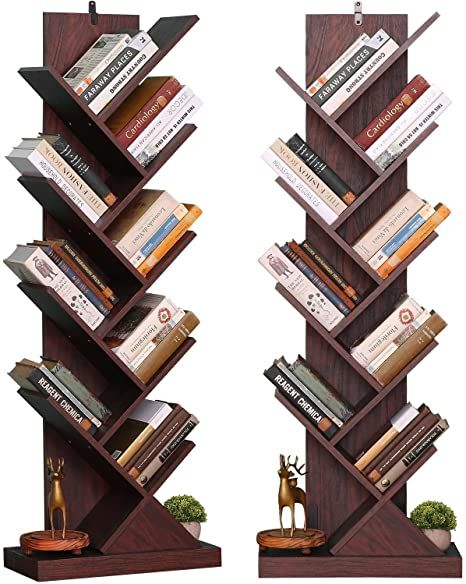 two tall bookshelves that are made out of wood and have different types of books on them