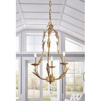 a chandelier hanging from the ceiling in a room with white walls and windows