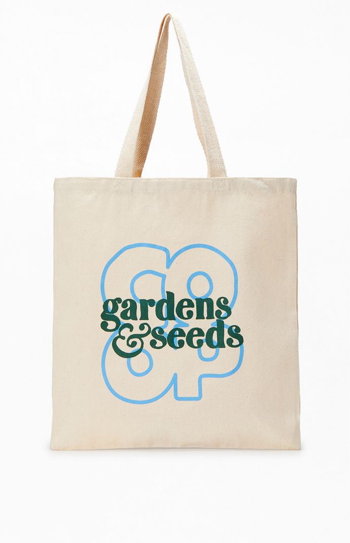 Elevate your essentials-carrying game with the Garden Seeds Co-Op Tote Bag, boasting fixed straps, a spacious canvas main compartment, and branded prints on the front for added style.


	Fixed straps
	Large compartment
	Canvas fabrication
	Front graphic Rectangular Canvas Bag For Travel With Logo Print, Functional Everyday Bags With Logo Print, Functional Bags With Logo Print, Rectangular Logo Print Canvas Travel Bag, Functional Logo Print Bag, Rectangular Travel Bags With Logo Print, Rectangular Travel Bag With Logo Print, Daily Use Rectangular Shoulder Bag With Logo Print, Everyday Logo Print Canvas Tote Bag