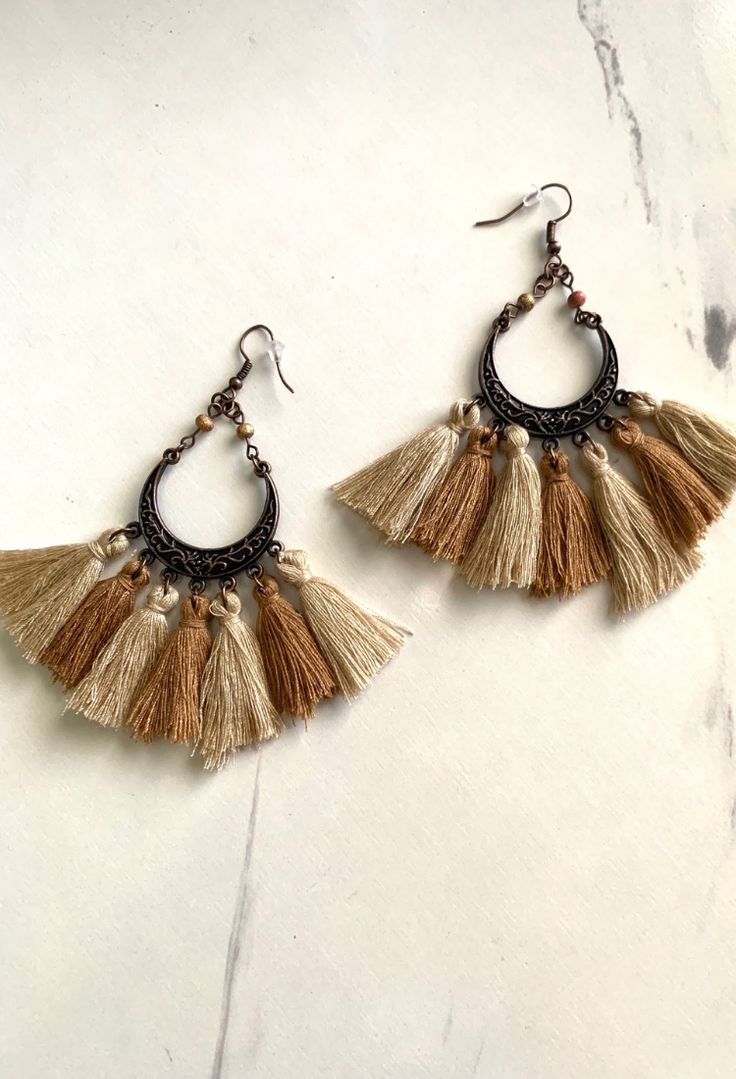 These Boho Earrings are seriously the bomb. They have an earthly casual feel with beads on the antique bronze drop and tassel fringe on the bottom. They are so light and comfy to wear all day or for a night out. Lead and nickel free Brown Tassel Earrings For Festivals, Brown Fringe Tassel Earrings For Festivals, Beige Bohemian Fringe Earrings, Adjustable Brown Bohemian Tassel Earrings, Bohemian Brown Tassel Earrings For Summer, Brown Bohemian Tassel Earrings For Summer, Beach Jewelry With Brown Tassels, Bohemian Brown Fringe Earrings, Beige Bohemian Jewelry With Fringe