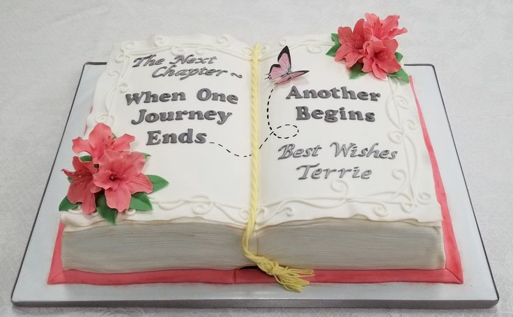 an open book cake with flowers on the side and words reading, when one journey begins, bear wishes terrie