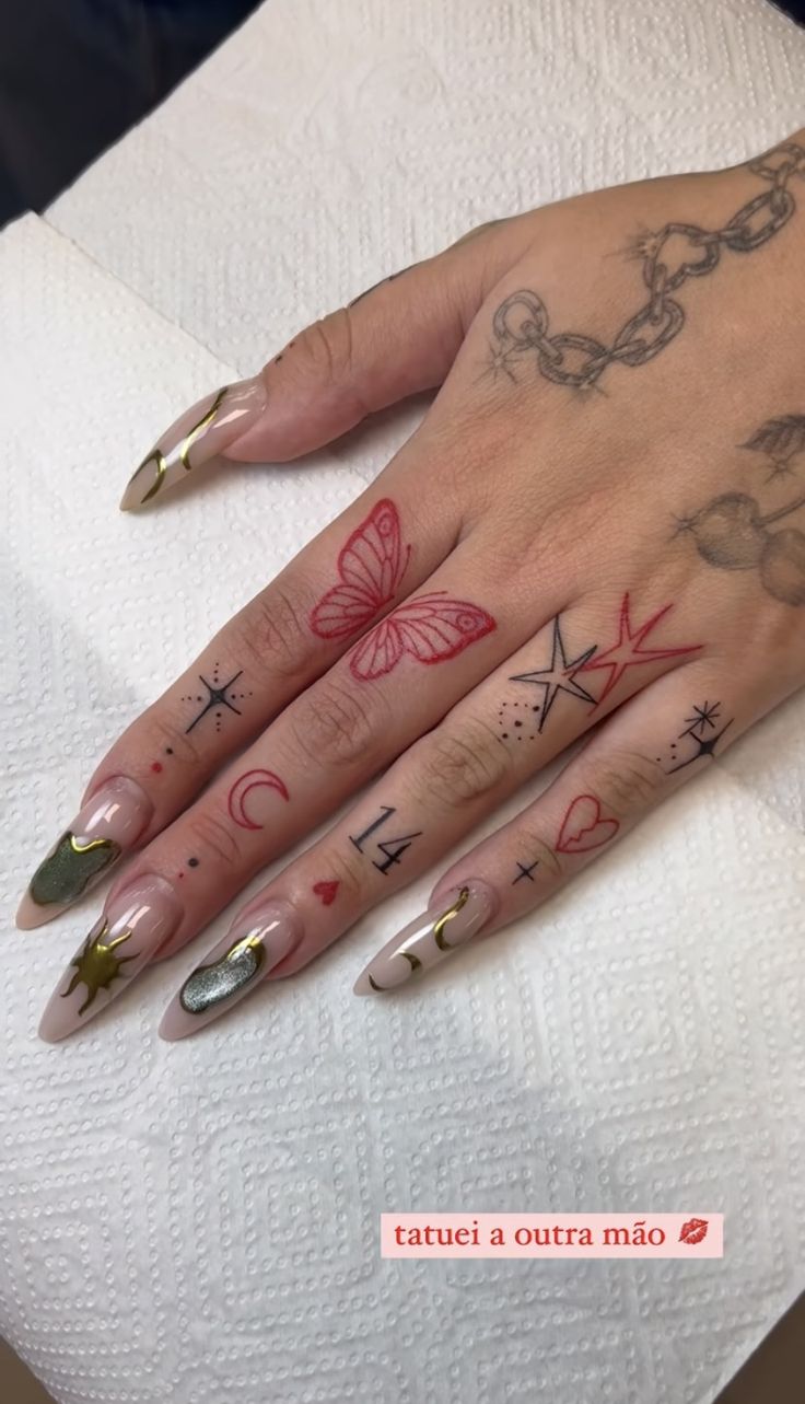 a woman's hand with tattoos on it