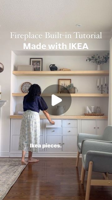 a woman standing in front of a book shelf