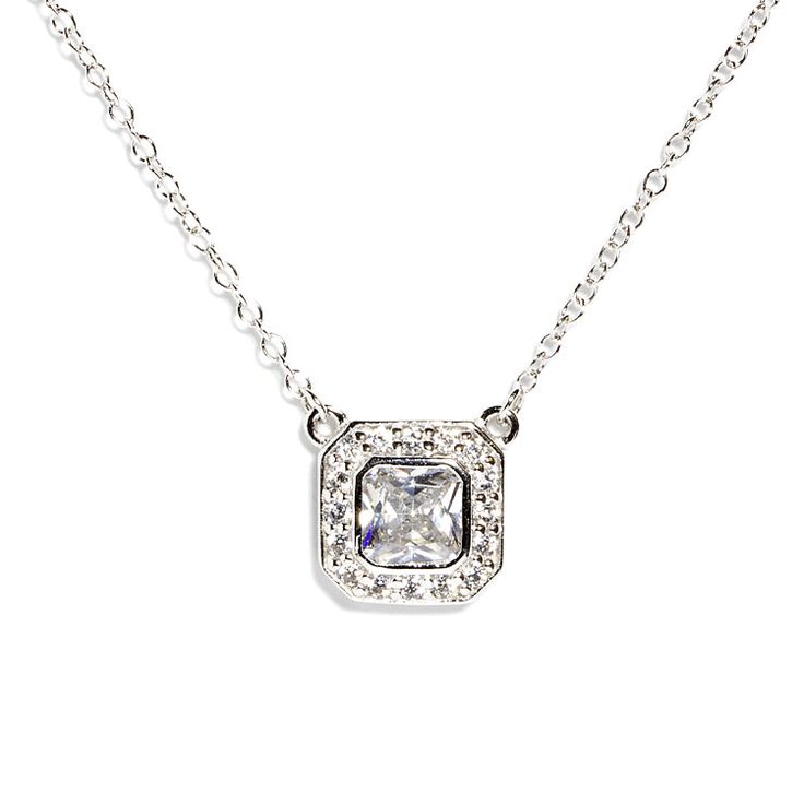 Coveted for its distinctive square shape and brilliant facets, this halo pendant necklace will elevate any look with its statement center stone. The cushion-cut was highly revered in the 19th century and still remains popular today. The chain has been accented with 8 CZ on square bezels. If you are drawn to classy and refined styles, this piece is for you. - Stones Material: Cubic Zirconia. - Stones Shape: Tiny Round and Large Square - Metal: 925 Sterling Silver. - Plating: Rhodium plated. - Cha Elegant Silver Rectangular Necklace, Elegant Cubic Zirconia Solitaire Necklace With Square Pendant, Classic Formal Necklace With Rectangular Pendant, Classic Formal Necklaces With Rectangular Pendant, Formal Cubic Zirconia Necklace With Square Pendant, Classic Silver Square Pendant Jewelry, Classic Jewelry With Adjustable Chain And Square Pendant, Solitaire Necklace With Diamond Accents And Square Pendant, Classic Solitaire Necklace With Square Pendant And Diamond Accents