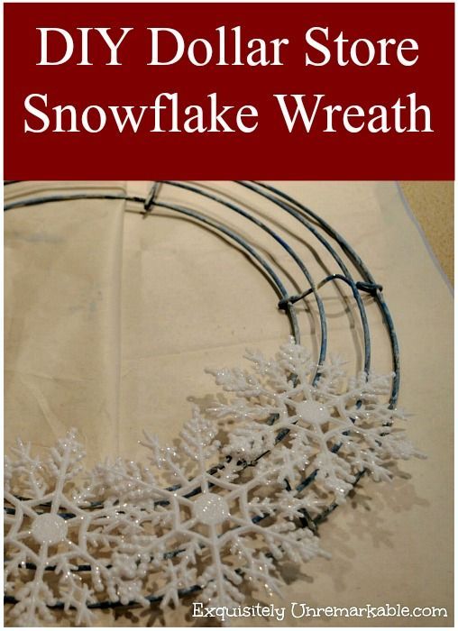 the diy dollar store snowflake wreath is made with wire and plastic snow flakes