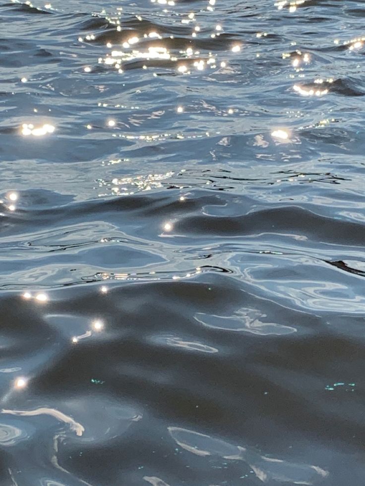 the water is very blue and has small bubbles on it