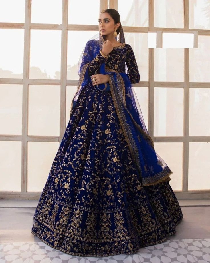 Lehenga : Tafeta Velvet Work : Embroidery Inner : Inner silk Flare : 3 MTR Type : Semi-Stitched Blouse Febric : Tafeta Velvet Work: Embroidery Size : 1.80 Mtr Sleeves: full With Motti lace Border Duppta Febric: Heavy Net Work : Embroidery Size : 2.30 MTR ⚖Weight : 1.5 KG Blue Bridal Lehenga, Velvet Choli, Royal Blue Lehenga, Chaniya Choli Wedding, Velvet Lehenga, Indian Lehenga Choli, Lehenga Choli Wedding, Blue Lehenga, Lehenga Online