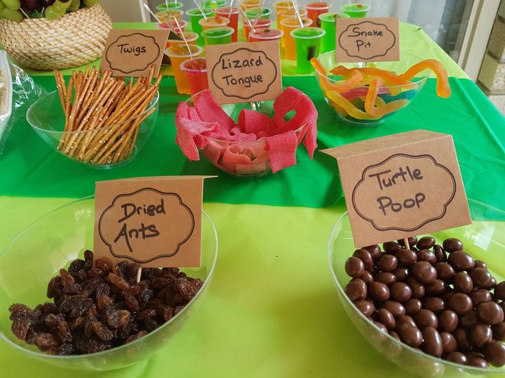 a table topped with lots of different types of candies and chocolate covered desserts