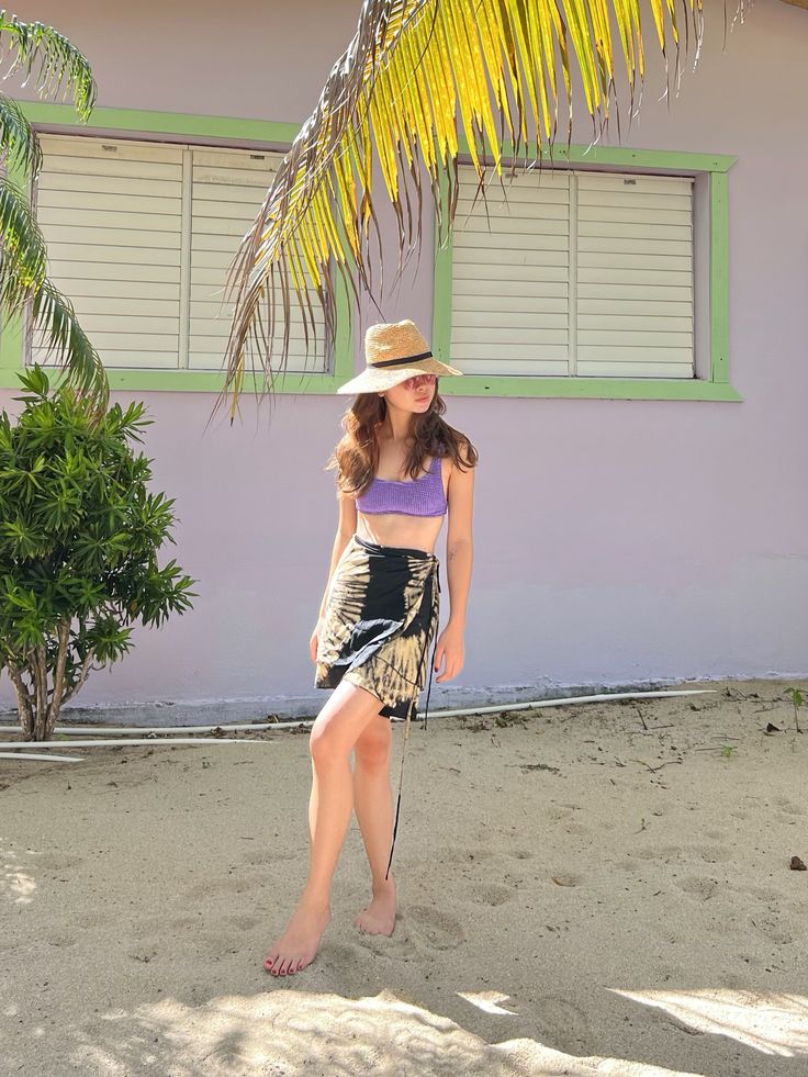 Dance the day away in our Mini Wrap Skirt. This fun and flirty silhouette adds a feminine feel to any outfit. Its lightweight fabric is perfect for days at the beach or your next tropical vacation. The tie-dye detailing adds a vintage-inspired twist while being right on-trend. This playful skirt is the perfect plus one for your next adventure as you chase after your wanderlust. It will take your swimsuit effortlessly from the beach to dinner with friends. Style with a crisp button-up blouse for Tropical Beach Skirt For Beach Season, Beachy Skirt For Beach Vacation, Beachy Skirt For Vacation, Tropical Beach Skirt For Vacation, Tropical Skirt For Beach Season Vacation, Tropical Beach Season Skirt For Vacation, Bohemian Wrap Skirt For Beach In Summer, Beachwear Wrap Skirt For Vacation, Beachwear Wrap Skirt For Vacation During Beach Season