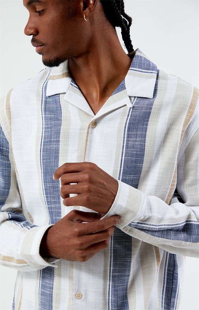 Introducing the Long Sleeve Camp Shirt from PacSun, crafted for comfort and style. Made with a lightweight cotton blend, it's perfect for any occasion. With its collared neckline, long sleeves, and button closures, this shirt offers a classic yet versatile look. Featuring a stylish striped pattern, it adds a touch of sophistication to your outfit.


	Collared neckline
	Long sleeves
	Standard fit
	Button closures
	Striped
	68% Cotton, 29% nylon, 3% spandex
	Machine washable
	Model is wearing size medium
	Model Measurements: 6'1” Height, 31” Waist, 32” Inseam Long Sleeve Cotton Tops With Placket, Long Sleeve Cotton Top With Placket, Cotton Long Sleeve Tops With Placket, Relaxed Fit Long Sleeve Camp Shirt For Beach, Relaxed Fit Long Sleeve Camp Shirt For Vacation, Cotton Camp Shirt With Casual Collar For Spring, Spring Cotton Camp Shirt With Casual Collar, White Long Sleeve Camp Shirt For Summer, Cotton Shirt With Collared Neckline For Beach