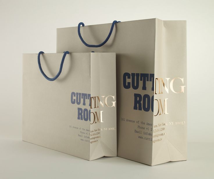 two shopping bags with the words cutting room printed on them