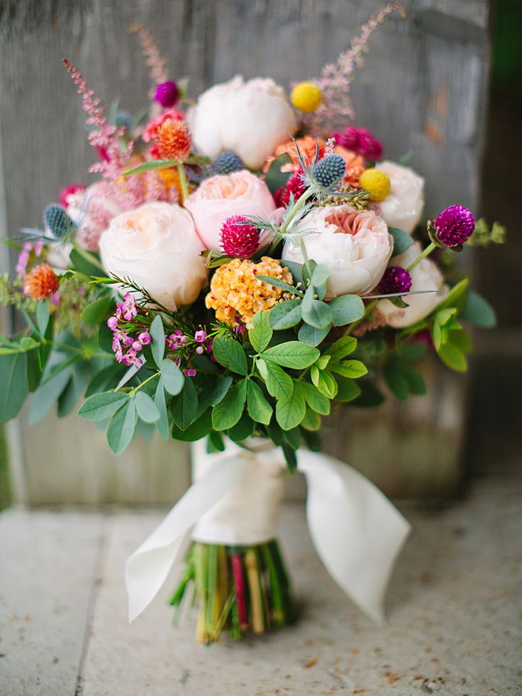 a bouquet of flowers is sitting on the ground