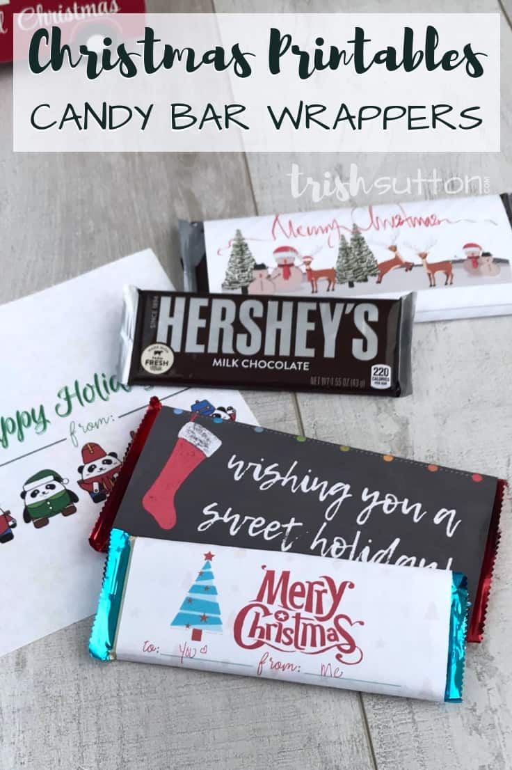 christmas printables candy bar wrappers on a wooden table with text overlay