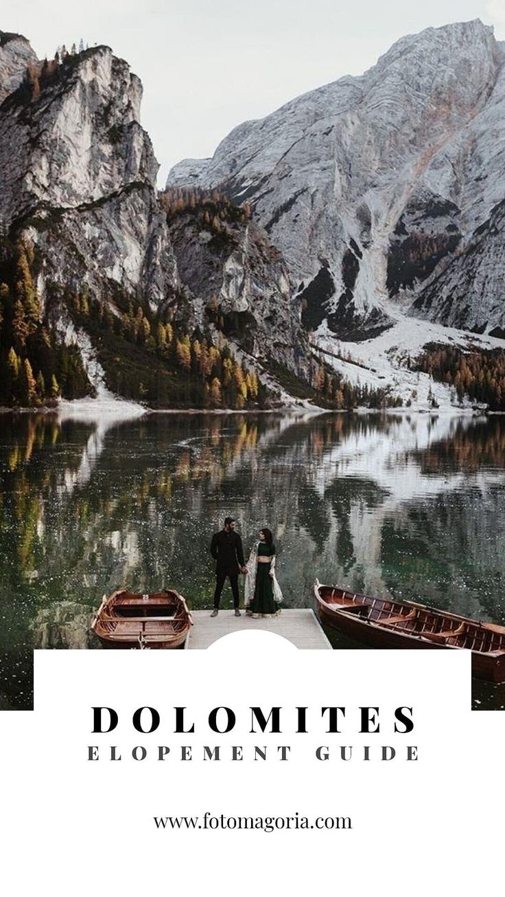 two people standing on a dock with boats in front of them and the words dolomites