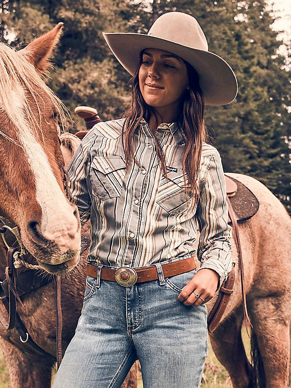 MADE TO WEAR EVERYWHERE A cowgirl can never have too many collared shirts for competition and daily life. Our Women's Wrangler Retro® All-Occasion Western Snap Dress Shirt is crafted a lightweight cotton and recycled materials blend that will keep you comfortable in everything you do. It comes with pointed yokes, pearl snaps, two chest pockets with the signature "W" stitching, and a contrast print at the cuffs. Western Photo Shoots, Western Photo, Collared Shirts, Western Women, Country Shirts, Loose Fit Jeans, Short Shirts, Western Outfits, Denim Shop